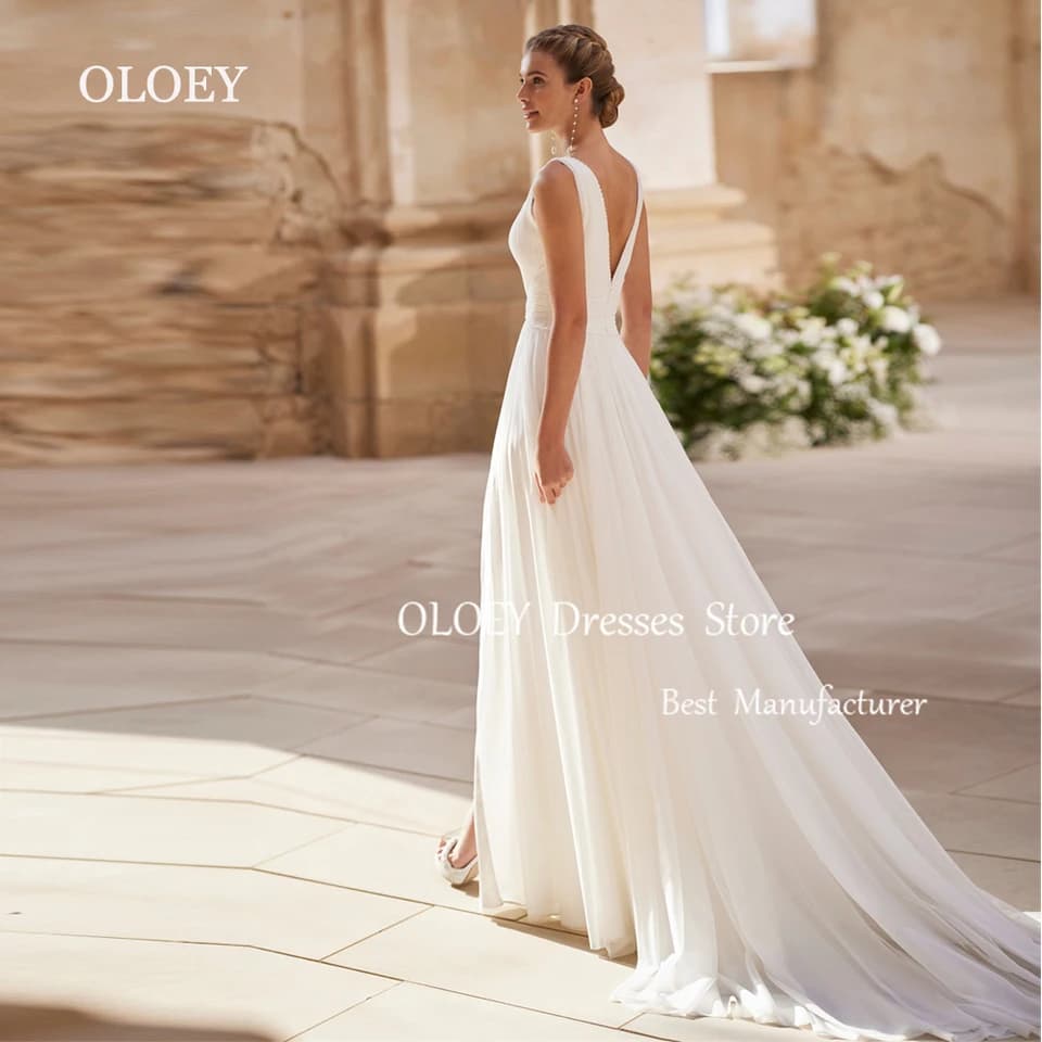 Elegantní svatební šaty OLOEY v barvě slonové kosti, výstřih do V, bez rukávů, korálky, perly, šifon, zapínání na zip na zádech, vyrobené na míru